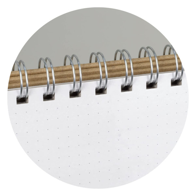 A white notepad with a spiral binding, featuring dotted pages and a wooden cover.
