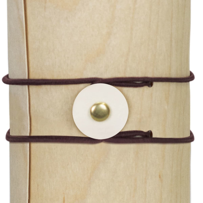 A drink bottle with a natural wood appearance, secured by dark brown straps and a circular fastening.