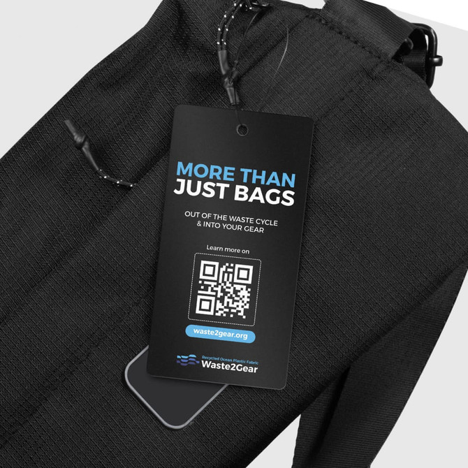 A black sling bag with a textured surface and a tag featuring a logo and QR code.