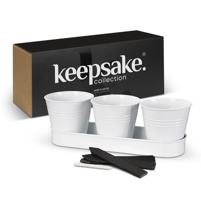 A white herb planter set with three pots and a tray, packaged in a black box with a logo.