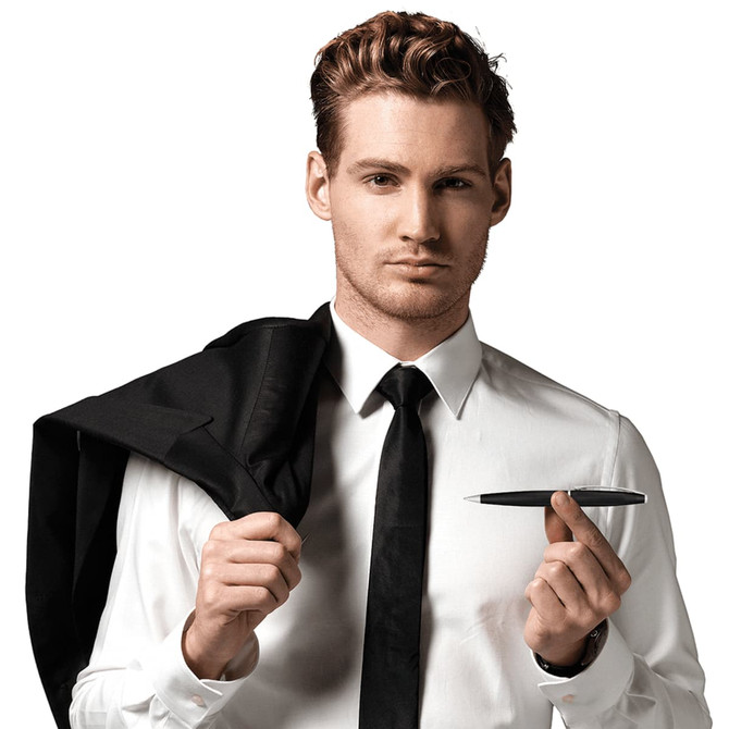 A man in a suit holds a black pen while draping his jacket over one shoulder. The pen has a sleek design and branding.