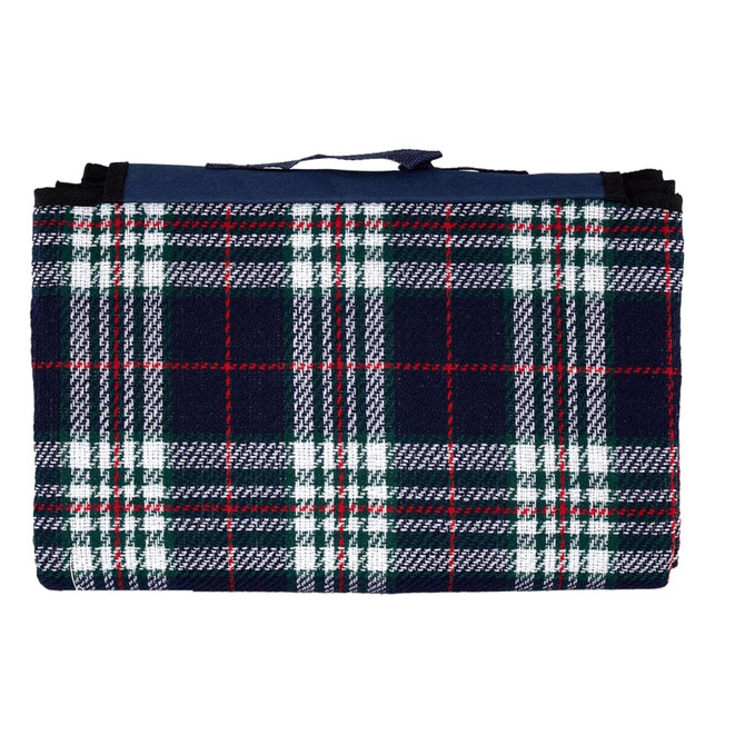 A folded picnic rug with a navy, green, and red tartan pattern, featuring a handle for carrying.