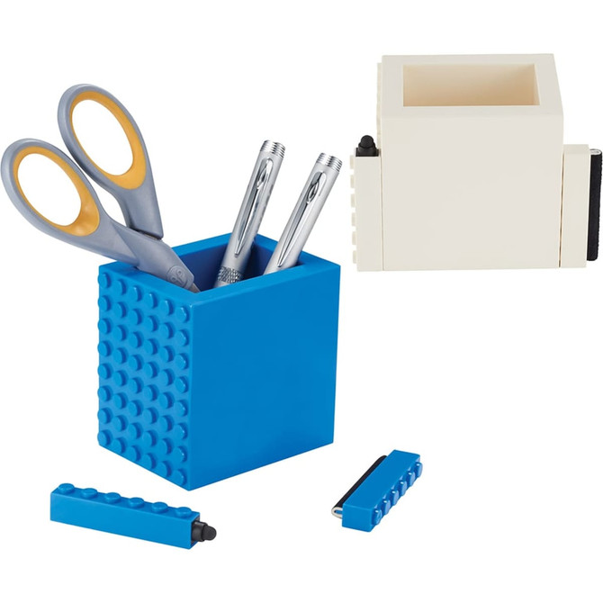 A blue pen pot with scissors and pens, accompanied by a white container and small accessories.