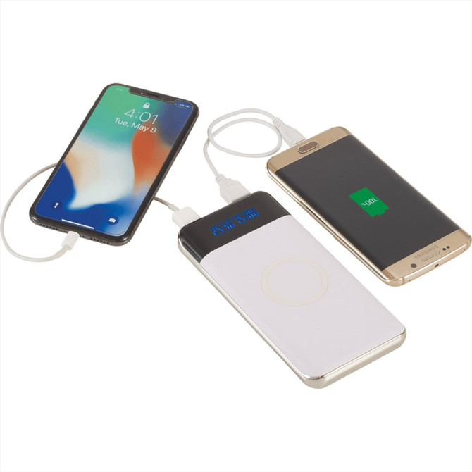 A white and gold wireless power bank with a display, connected to two smartphones.