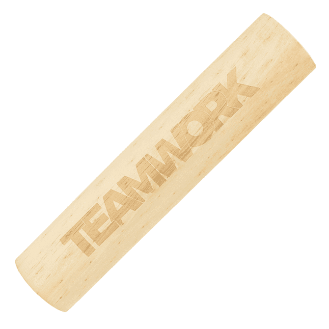 A wooden cylindrical game piece with an engraved "TEAMWORK" design, featuring a light natural wood colour.