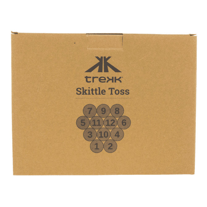 A brown cardboard box containing circular skittle game pieces, featuring a logo and numbers printed on them.