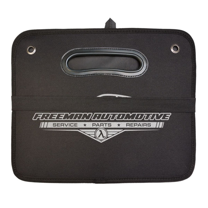 A black Cargo Storage Organiser with a handle and a logo, featuring a smooth surface and securing strap.
