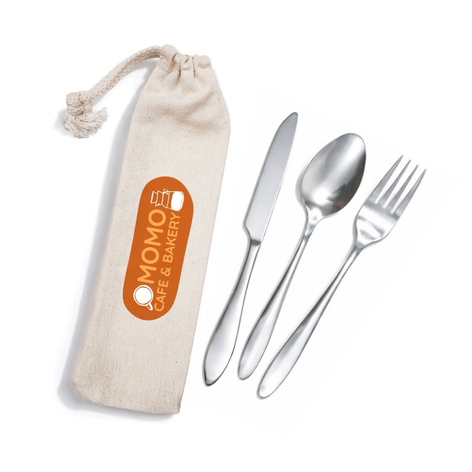 A cutlery set consisting of a fork, knife, and spoon in a cream-coloured calico pouch, featuring a logo.