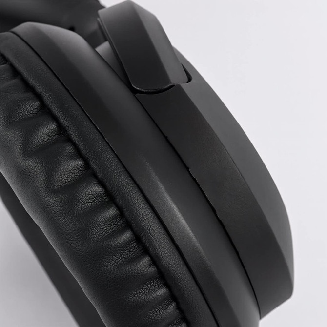 Black headphones with cushioned ear pads and a sleek design, featuring a branding logo on the side.