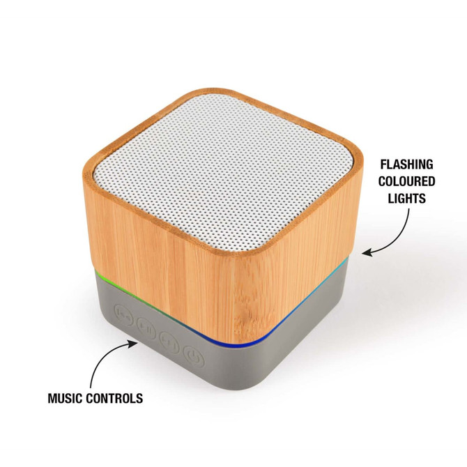 A square Bluetooth speaker with a bamboo exterior, silver mesh top, and colored music control buttons at the base.
