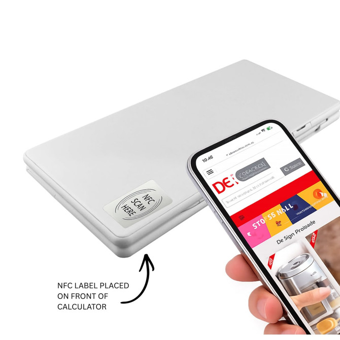 A silver calculator with an NFC label on the front, positioned beside a smartphone displaying a website.