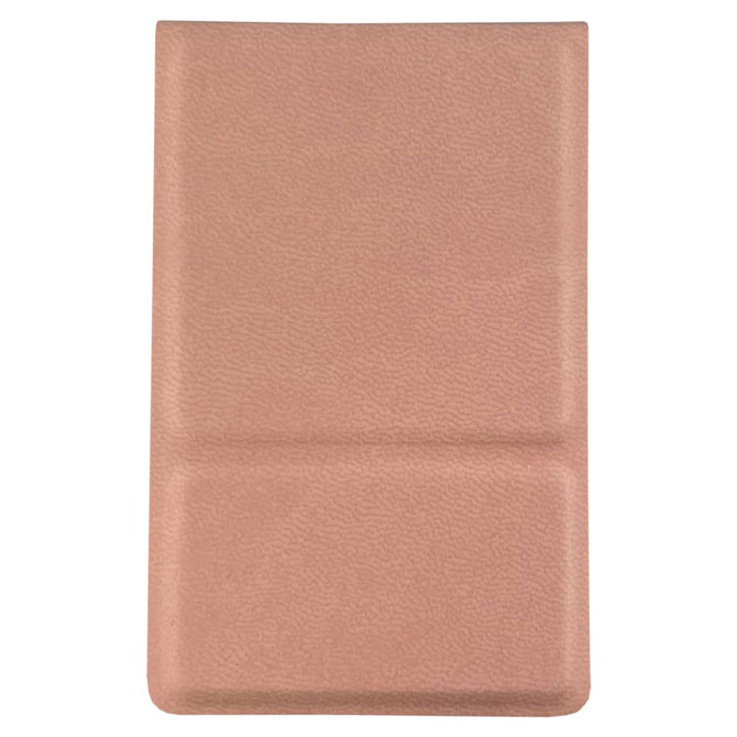 A compact mirror in a soft pink case with a textured finish and a logo.
