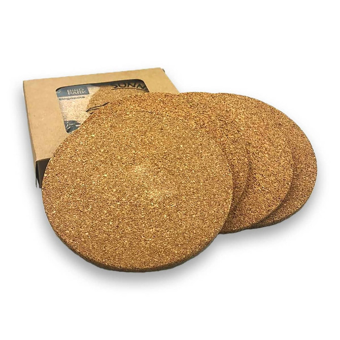 Round cork coasters in a natural brown finish, packaged in a simple box. Set of four coasters with branding visible.