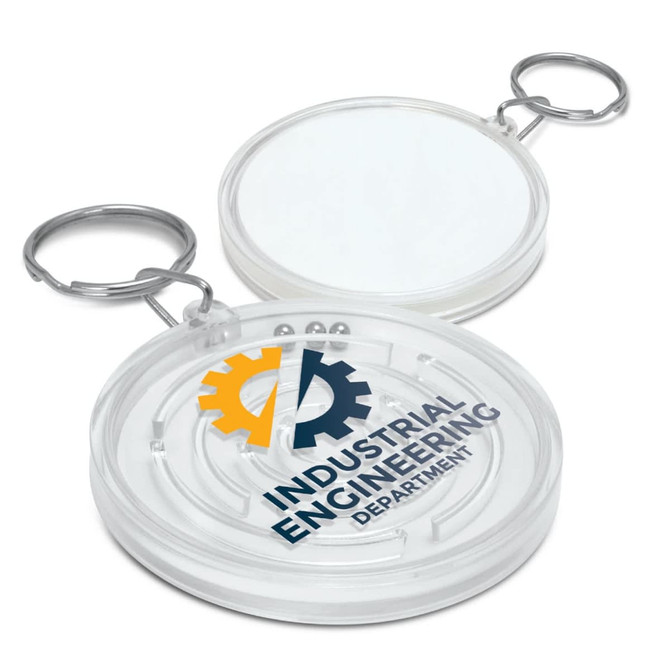 A circular clear key ring featuring a maze design and a logo, with a silver metal keychain attachment.