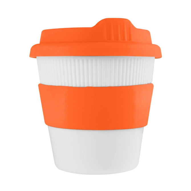 A reusable coffee cup in white with an orange silicone band and lid, featuring a logo.
