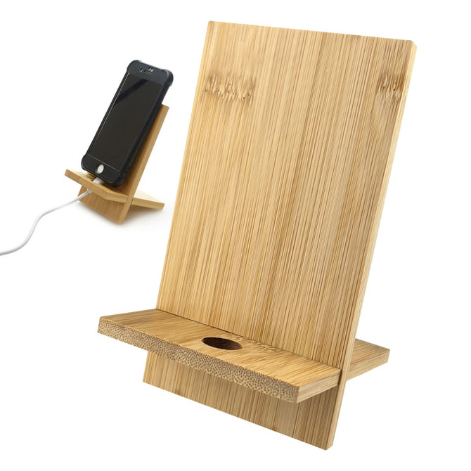A bamboo phone holder with a sleek design, featuring a stand and a slot for charging cables.