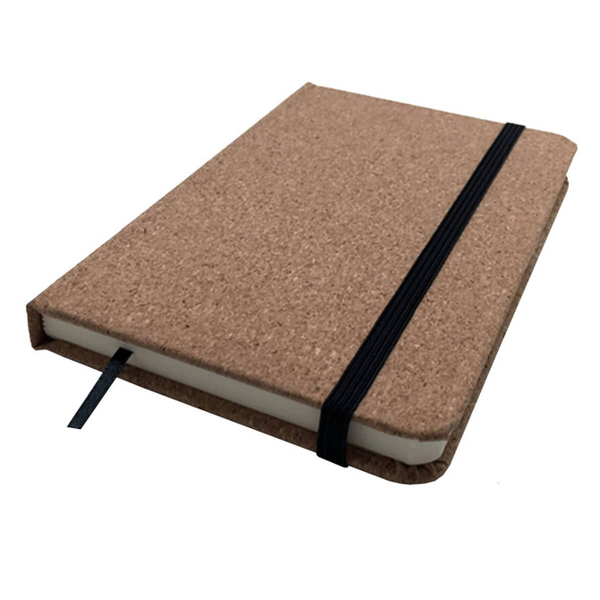A cork-covered A6 notebook with a black elastic band, featuring a soft wood finish and a ribbon bookmark.