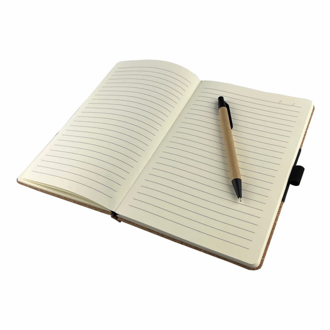 An open notebook with lined pages and a black pen resting on the right side. The cover is brown and features a branding logo.