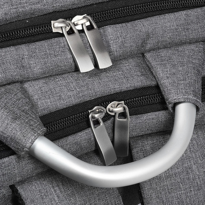 A grey laptop backpack with dual zippers and a silver handle. It has a textured fabric and features branding.