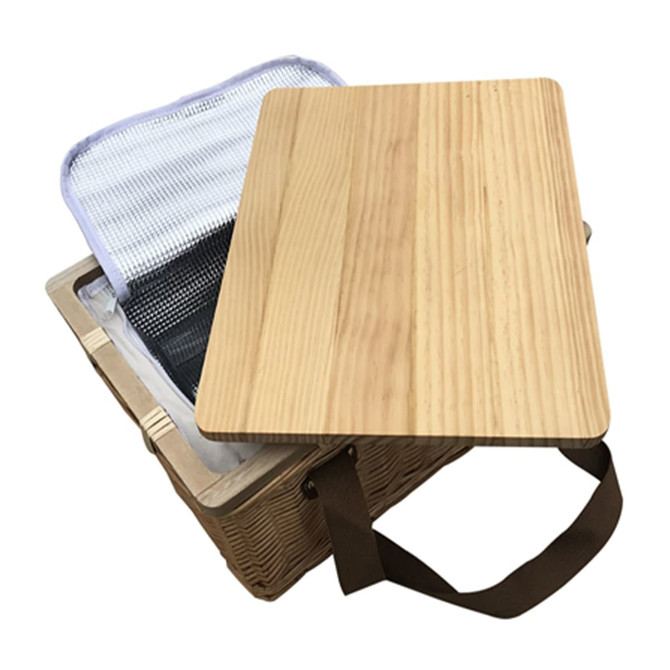 A wicker picnic cooler basket with a wooden lid and a silver insulated interior. Brown carrying strap included.