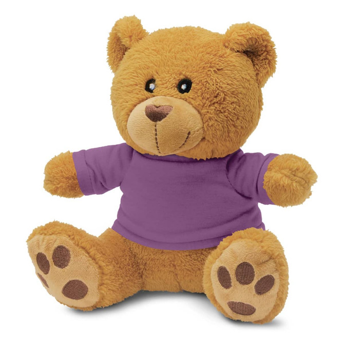 A plush teddy bear toy, featuring a soft, tan body and a purple shirt, with rounded ears and paw prints on its feet.