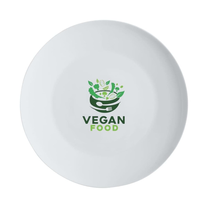 A white coupe dinner plate featuring a design related to vegan food and a logo.