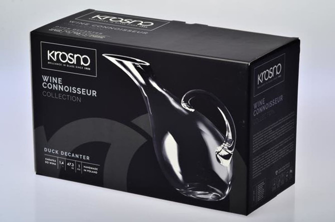 A duck-shaped decanter in a sleek, clear glass design, packaged in a black gift box with branding.