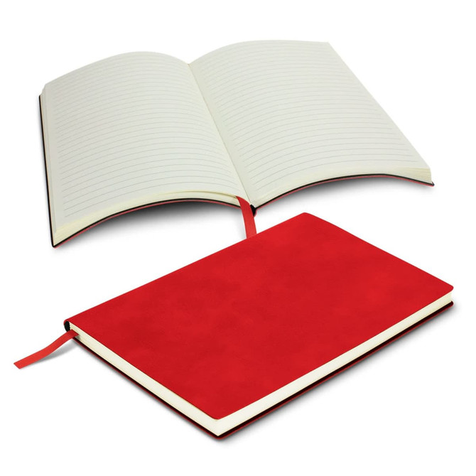 A red soft cover notebook with lined pages, featuring a ribbon bookmark and an embossed design on the cover.