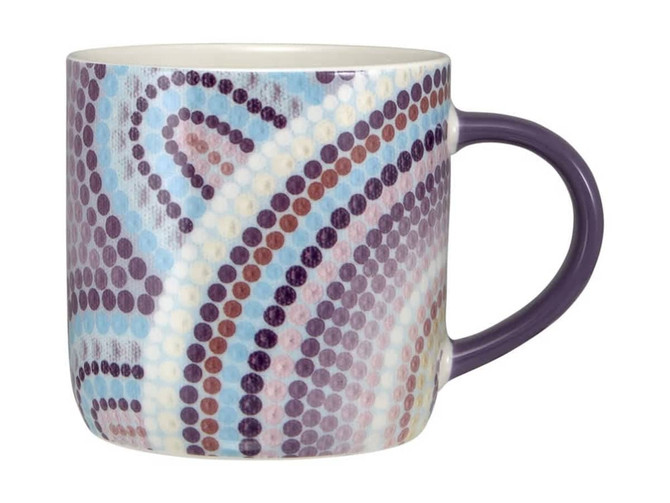 A coffee mug with a colourful dotted design featuring shades of blue, purple, and pink. It has a purple handle.
