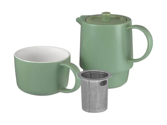 A green tea for one set featuring a teapot, cup, and metal infuser, presented in a gift box.