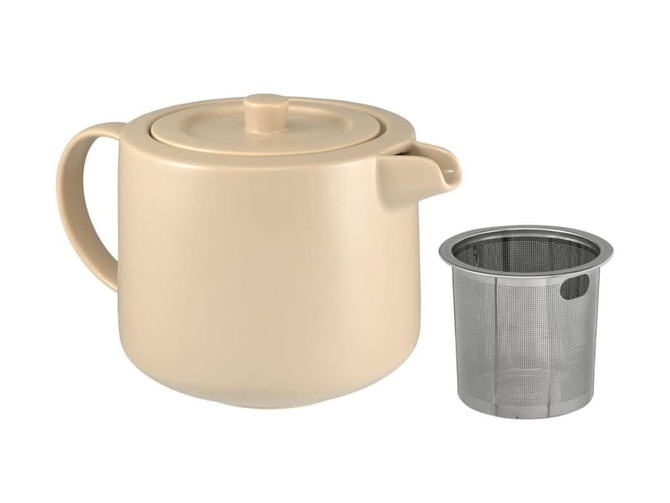 A beige teapot with a lid and a separate stainless steel infuser, presented in a boxed set.