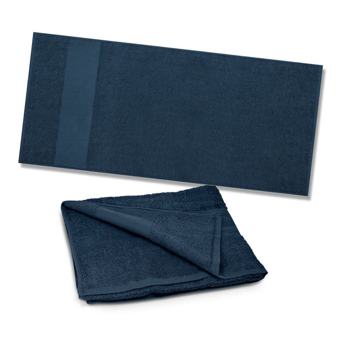 A dark blue Dune Beach Towel with a textured surface and a smooth band at one end, folded and laid out flat.