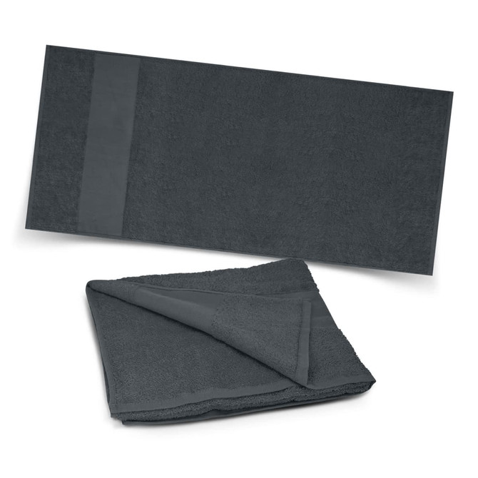 A Dune Beach Towel in a deep gray color, featuring a folded version and a flat view showcasing its soft texture.