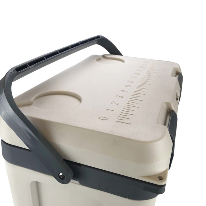 A beige cooler box with a grey handle and measurement markings on the lid. The box has a logo on it.