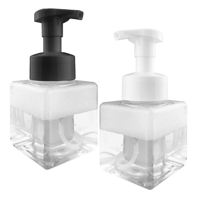 A black and a white foaming soap dispenser with clear bases, featuring a pump mechanism on top.