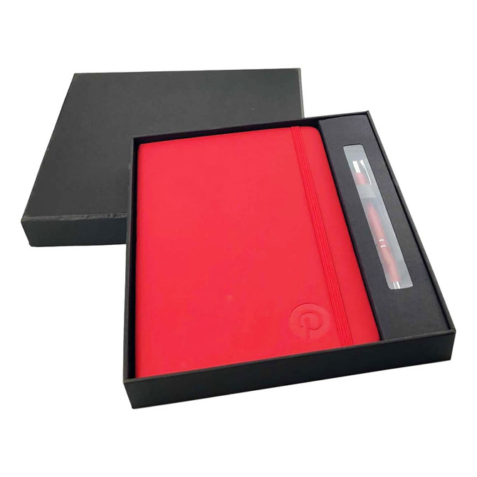 A red A5 notebook and a pen, both presented in a black gift box. The notebook features a logo.