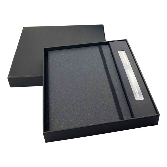A black notebook and pen gift set presented in a black box with a sleek design. The notebook features a smooth cover.