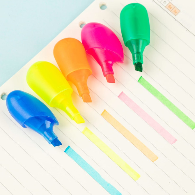 Five highlighters in blue, pink, orange, yellow, and green arranged on lined paper, with matching ink marks above each.
