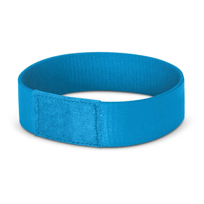 A blue wristband with a smooth finish and a branding logo, designed for events and exhibitions.