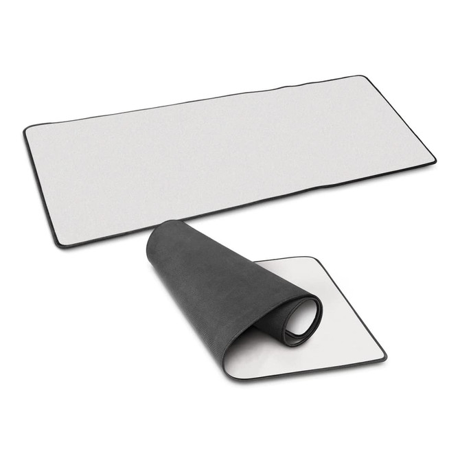 A Jumbo Desk Mat in white with a black border, displayed flat and rolled up partially to show both sides.