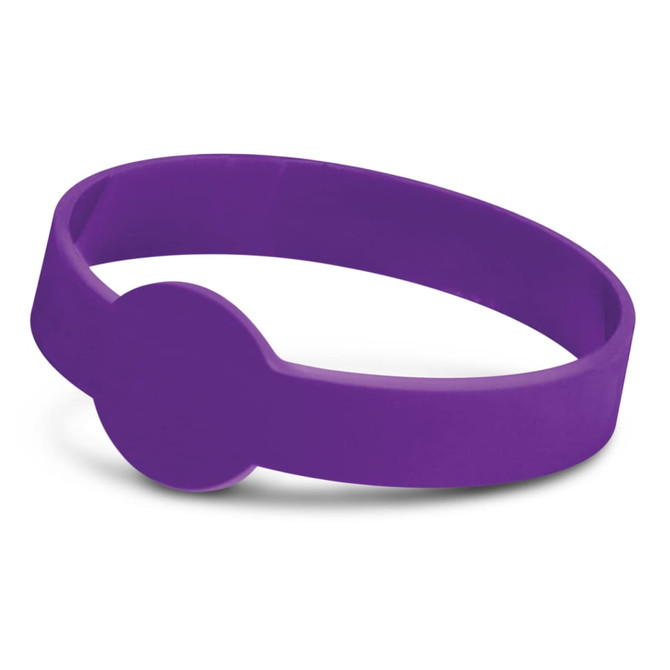 A purple silicone wristband with a debossed circular design. It features a logo on its surface.