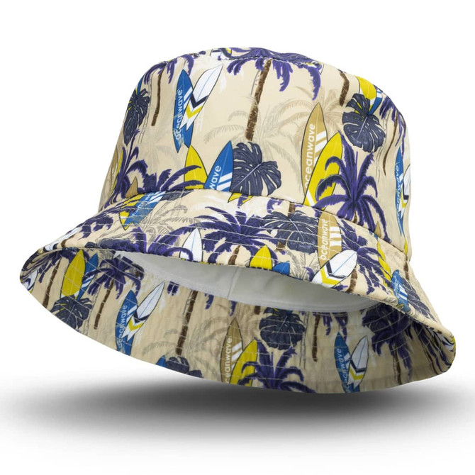 A custom bucket hat featuring a white, beige, and blue surf pattern with palm trees and a logo.