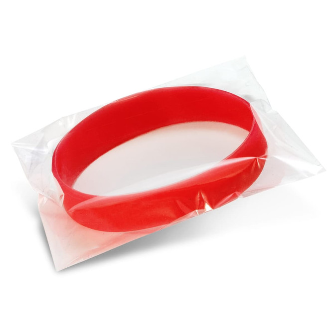 A red silicone wristband displayed in a clear plastic pouch, with a simple, smooth design.
