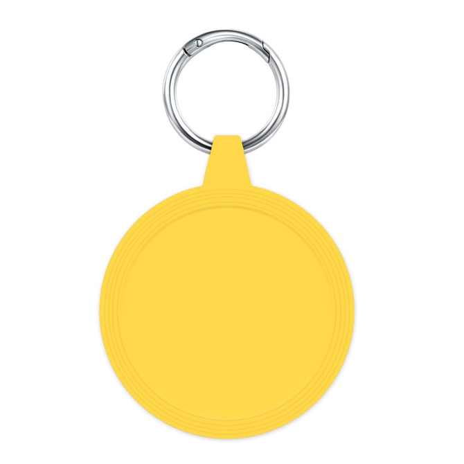 A yellow circular keychain with a metal ring is displayed against a white background, featuring a smooth surface.
