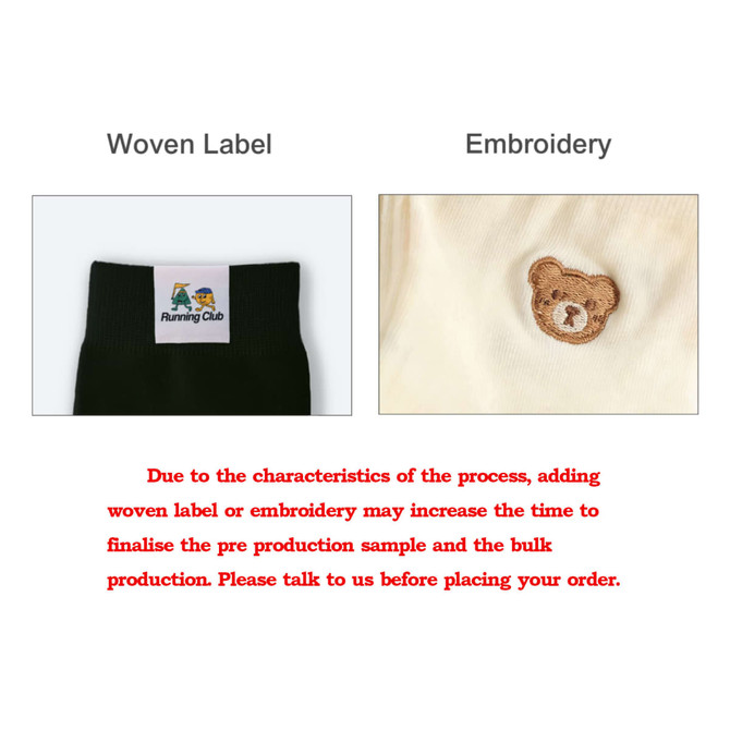 A close-up of two fabric details: a woven label and an embroidered bear, both on a clothing item.