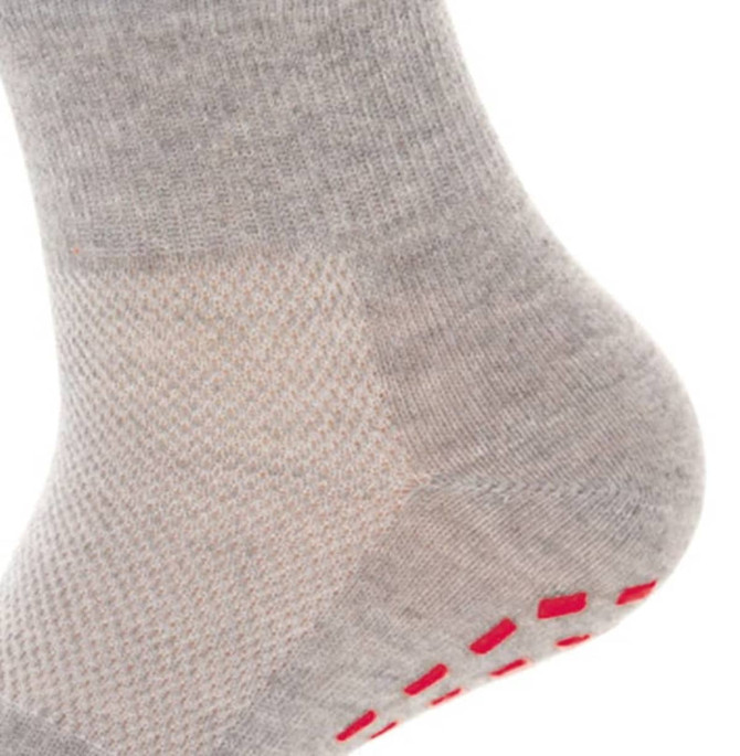 A grey sock featuring a textured design and red grips on the sole. It has a branding logo.