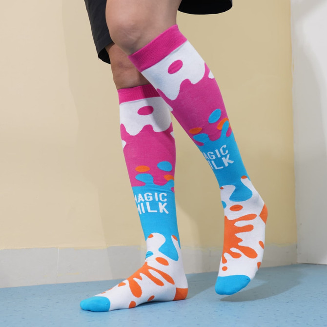 Knee-high socks featuring a vibrant pink, blue, and orange splash pattern with a logo.
