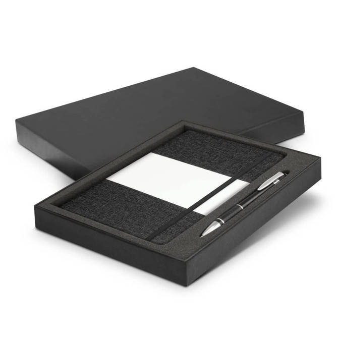 A black gift box containing a dark grey notebook and a silver pen. The notebook includes a section for notes.