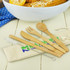 A bamboo cutlery set featuring a fork, spoon, knife, straw, and cleaning brush, all stored in a fabric pouch.