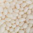 A close-up of white jelly beans, featuring a glossy and smooth surface, scattered closely together.